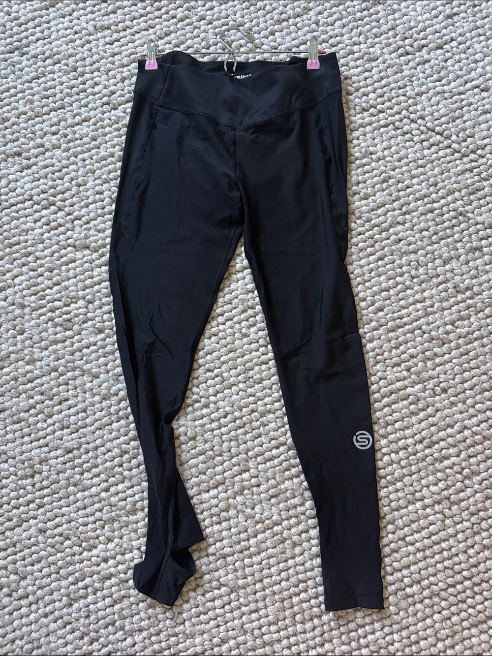 SKIMS Black High-Waist Performance Leggings with Logo. With footing.